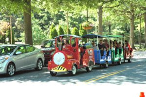 Friendship Heights Village Center members/residents enjoying a train ride around the area during the 4th of July.